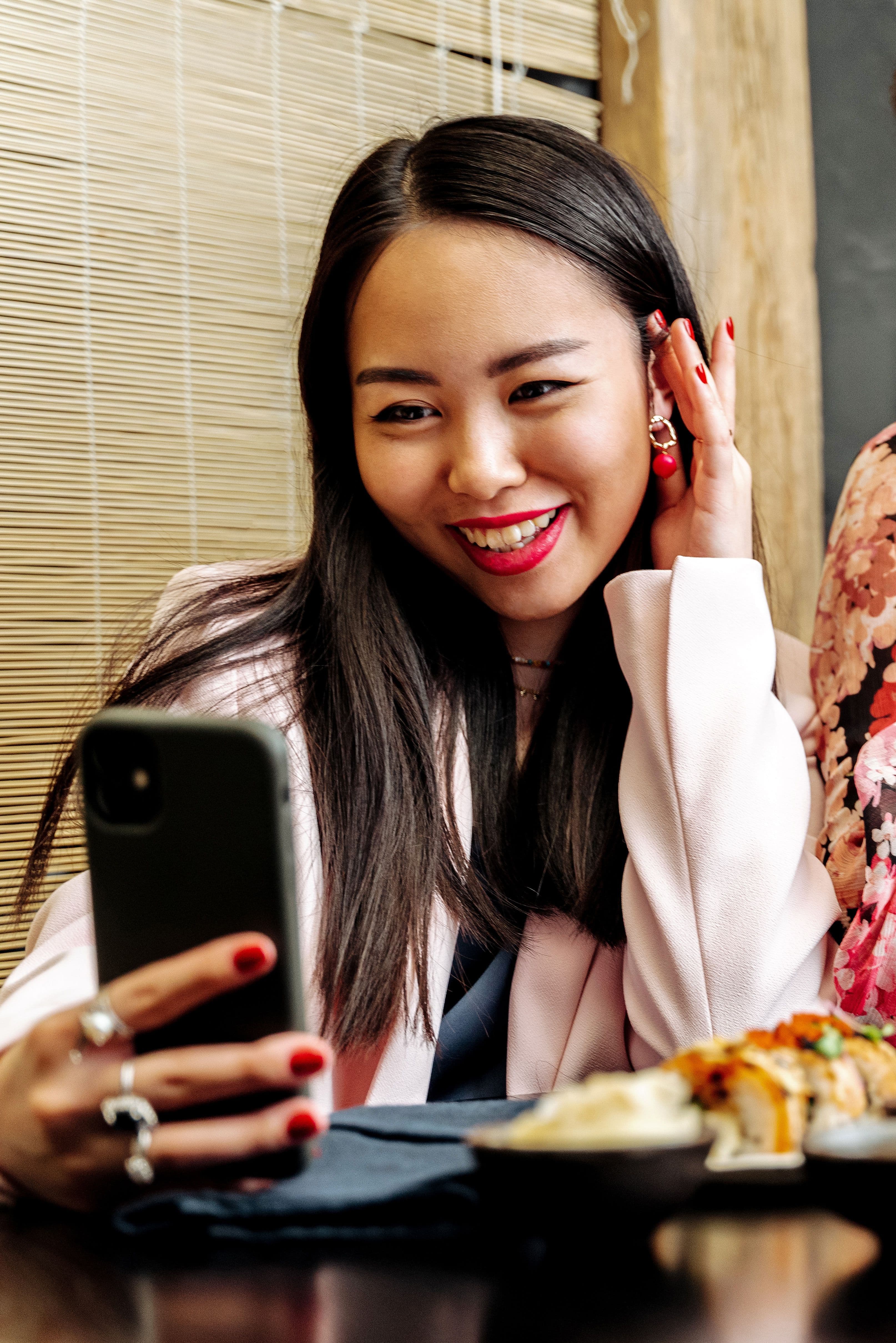 Guest looking at a phone over a restaurant table