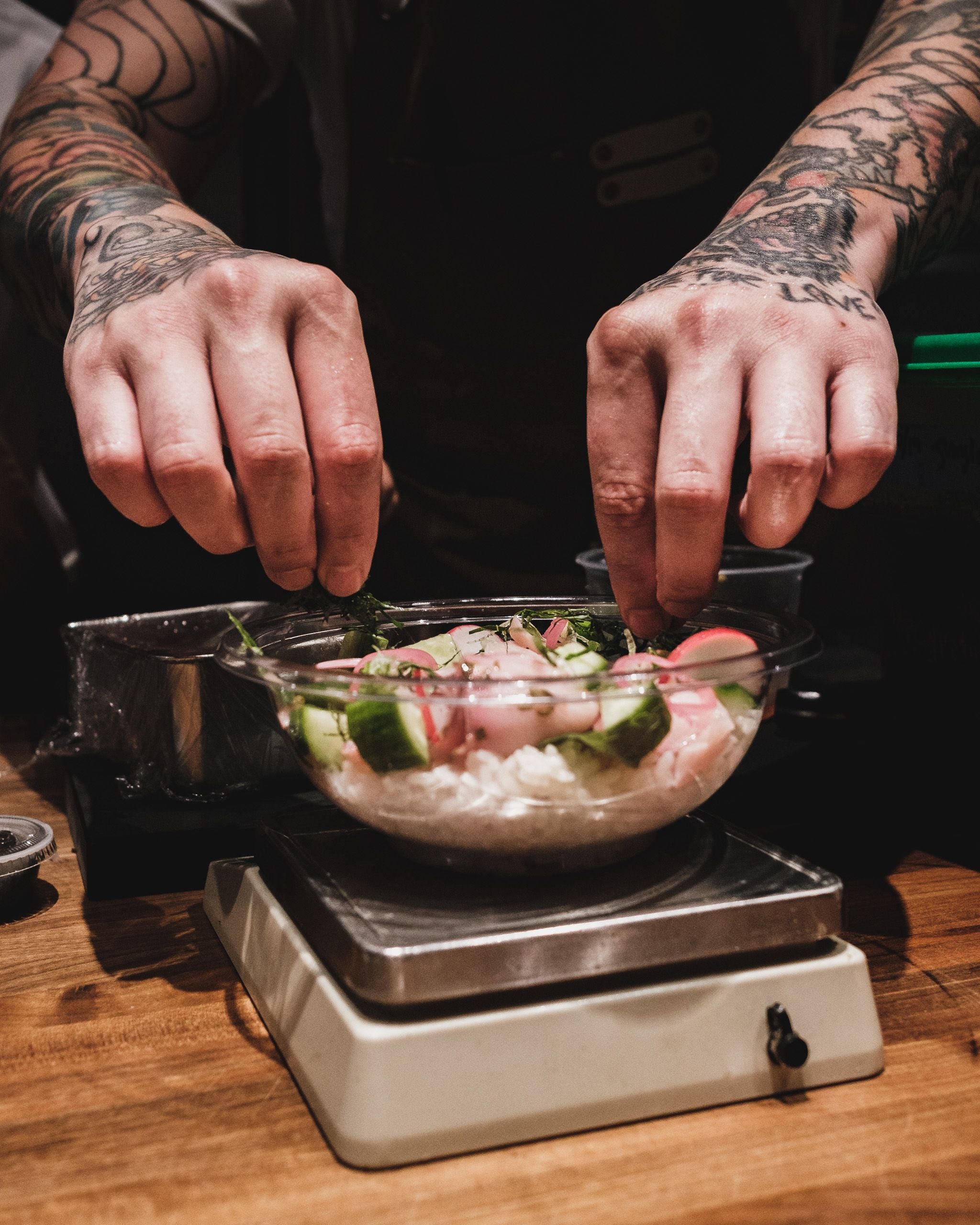 Chef portioning ingredients on a scale