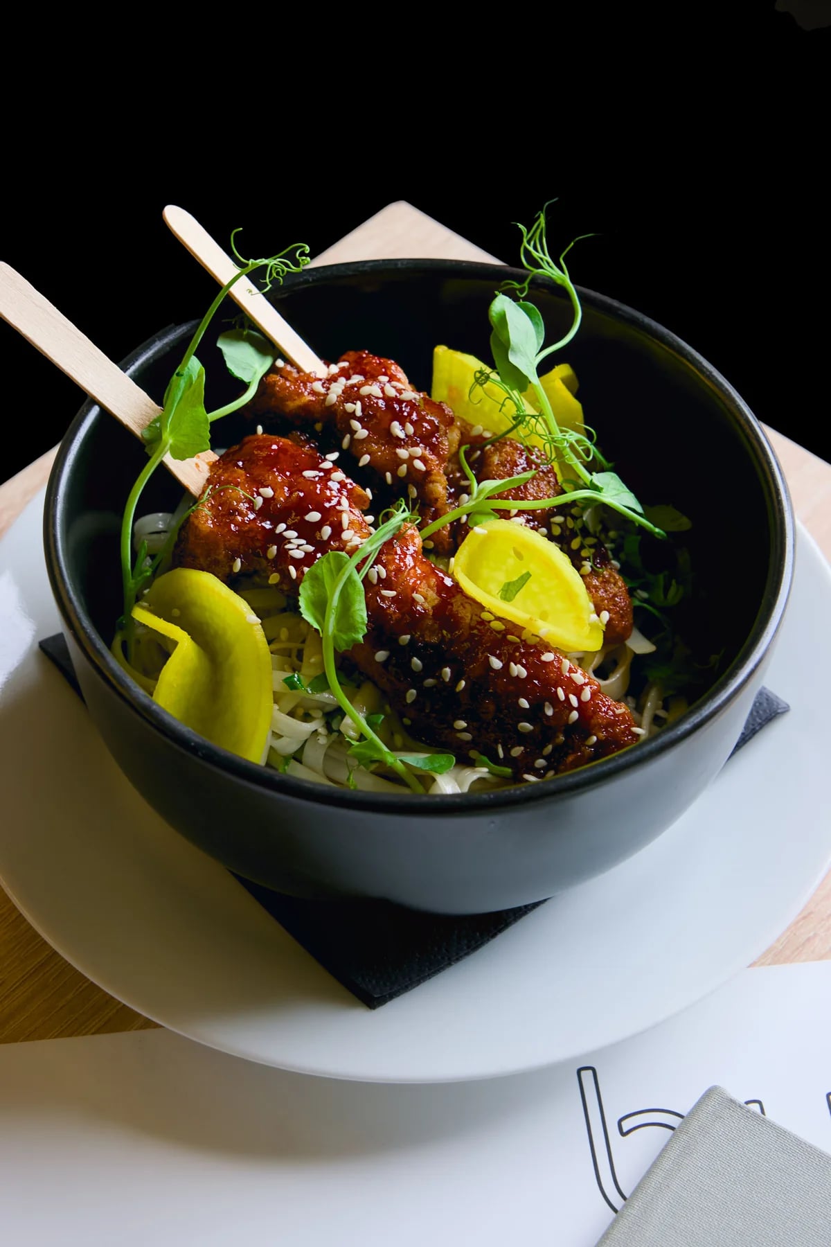 Korean Beef Bowl with noodles, pickled vegetables and sesame